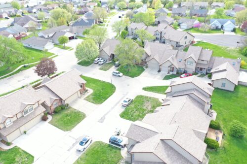 Aerial view of condos with light brown asphalt roofs - Big Boy's Construction