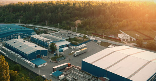 An industrial complex with buildings with metal roofs