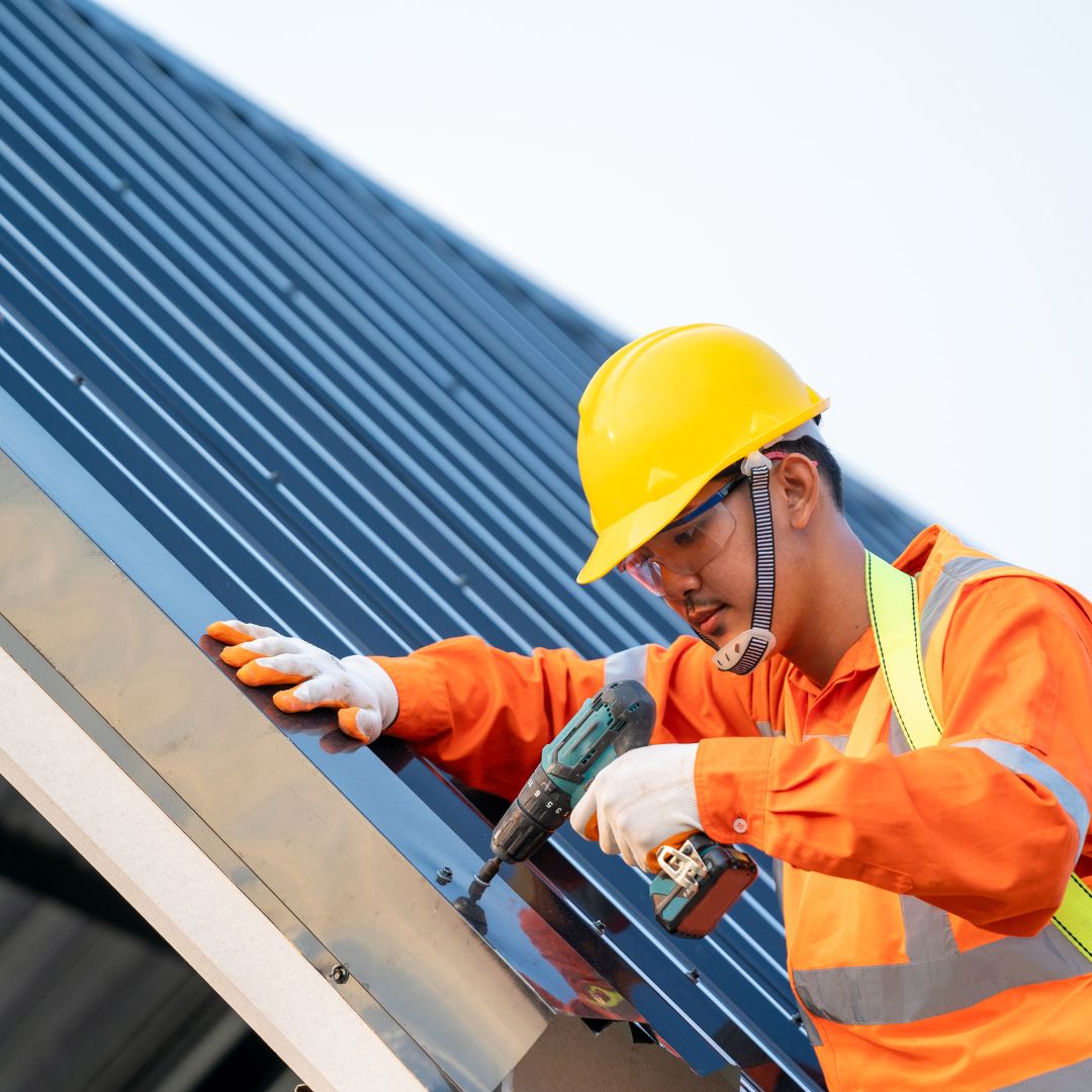 a commercial roofer working on a roof