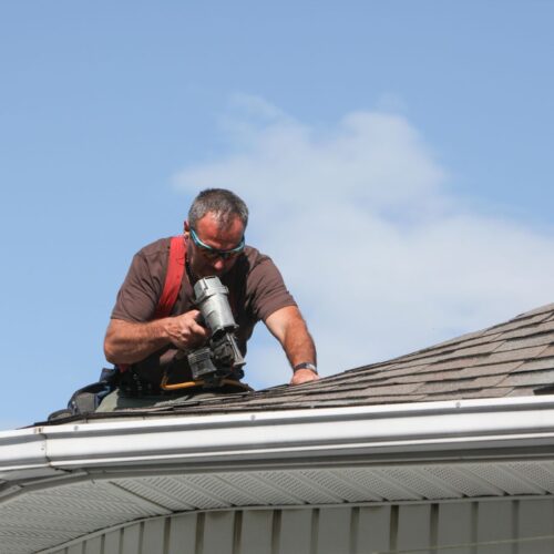 roofer installing roof