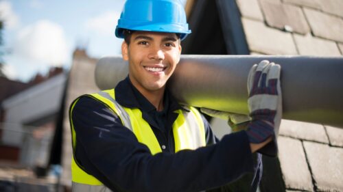 man carrying a pipe