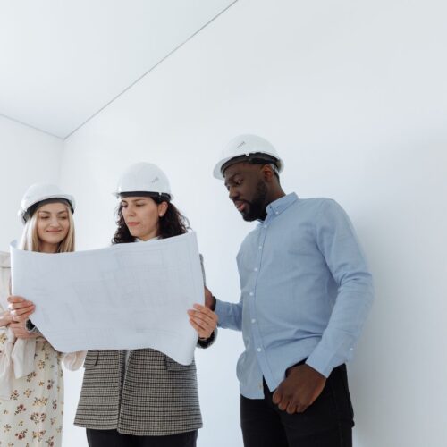 Contractors looking over blueprints