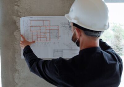 A contractor looking through blueprints