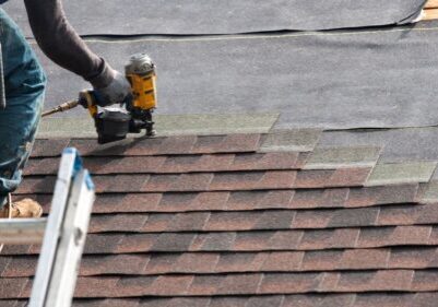 roofer putting on shingles